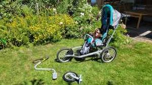 Hilfsmittel: Rehabuggy von Ottobock mit Fahrraddeichsel